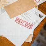 past due and bankruptcy papers on table